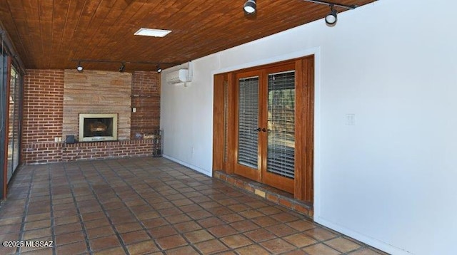 view of patio / terrace with french doors, an outdoor brick fireplace, and a wall mounted AC