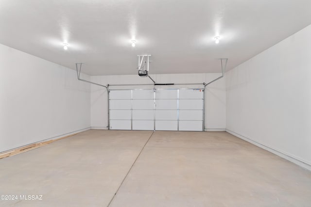garage featuring baseboards and a garage door opener