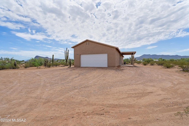 detached garage with a mountain view