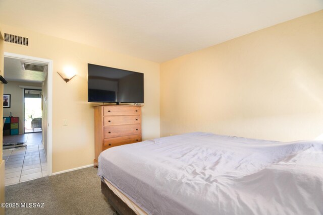 carpeted bedroom with a closet