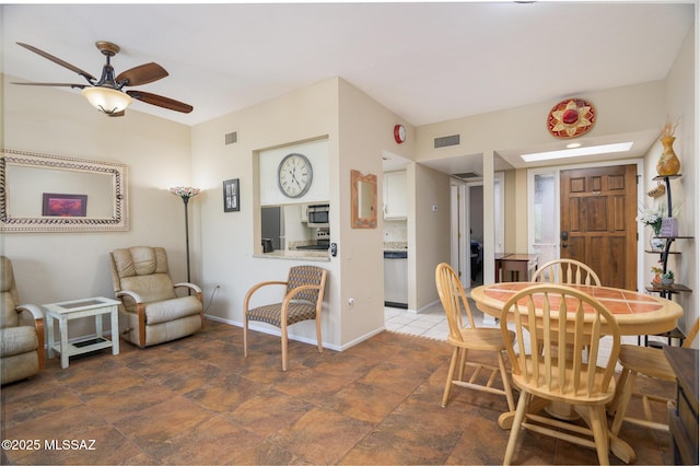 dining space featuring baseboards, a ceiling fan, and visible vents