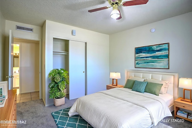 3061 W Avenida Cresta, Tucson, AZ 85745 - bedroom with a closet, a ceiling fan, and a textured ceiling