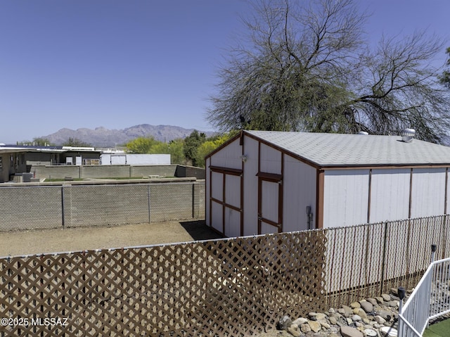 3061 W Avenida Cresta, Tucson, AZ 85745 - view of shed with a mountain view and a fenced backyard
