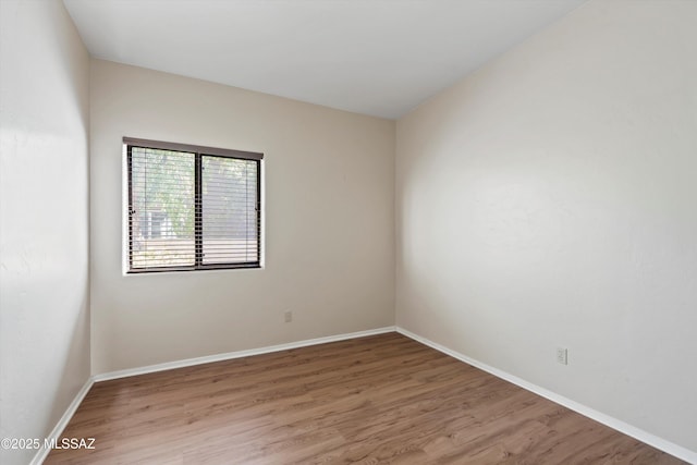 11460 N Palmetto Dunes Ave, Tucson, AZ 85737 - spare room with light wood-style flooring and baseboards