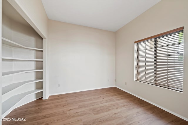 11460 N Palmetto Dunes Ave, Tucson, AZ 85737 - spare room featuring baseboards and wood finished floors