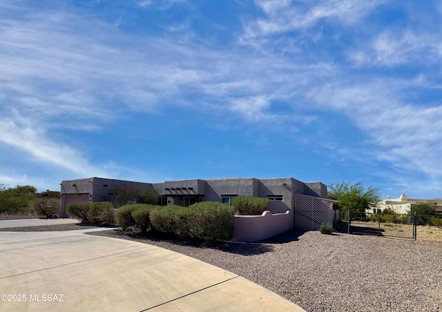 3021 E Dellwood Pl, Vail, AZ 85641 - view of side of property featuring fence, a gate, and stucco siding