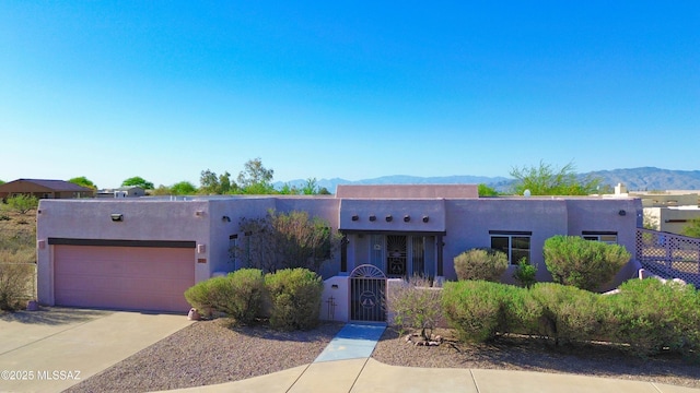 3021 E Dellwood Pl, Vail, AZ 85641 - southwest-style home with a garage, a mountain view, stucco siding, and concrete driveway