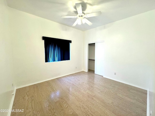 3021 E Dellwood Pl, Vail, AZ 85641 - unfurnished room with baseboards, ceiling fan, and wood finished floors