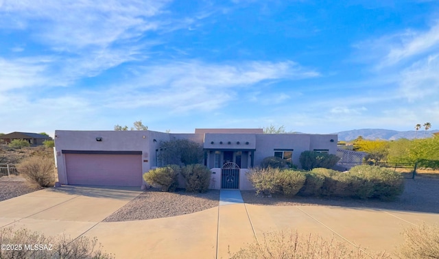 3021 E Dellwood Pl, Vail, AZ 85641 - southwest-style home with fence, an attached garage, driveway, and stucco siding