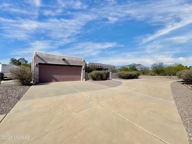 3021 E Dellwood Pl, Vail, AZ 85641 - view of property exterior with stucco siding and driveway