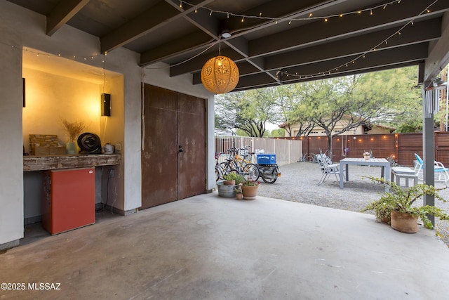 1321 N Norris Ave, Tucson, AZ 85719 - fenced backyard featuring a patio and outdoor dining area