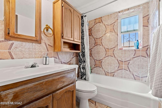 full bath featuring tile walls, toilet, shower / bathtub combination with curtain, and vanity