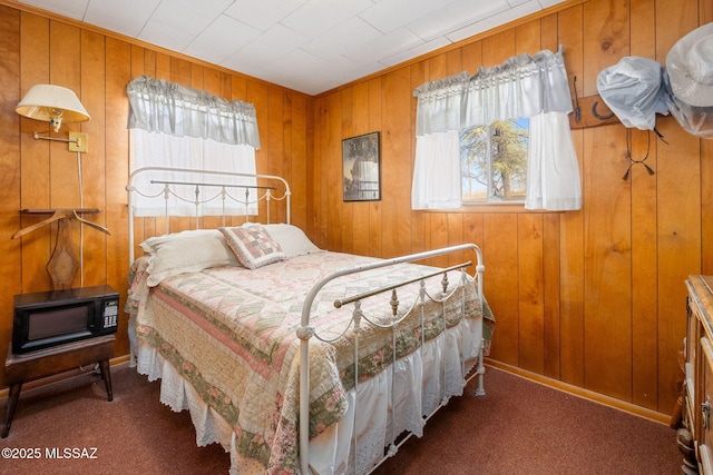 822 E Pomerene Rd, Benson, AZ 85602 - bedroom featuring carpet flooring and wooden walls
