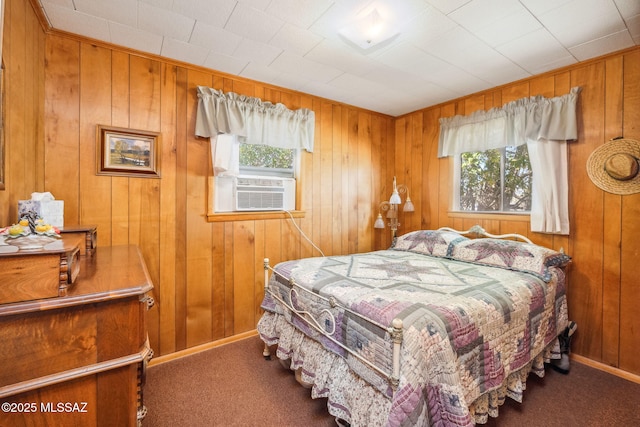822 E Pomerene Rd, Benson, AZ 85602 - bedroom featuring multiple windows, carpet floors, cooling unit, wood walls, and baseboards