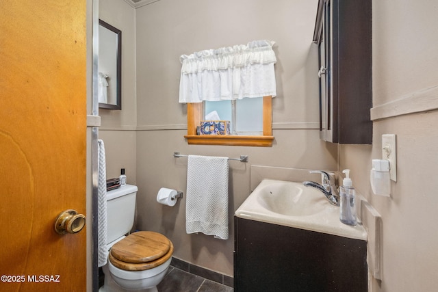 822 E Pomerene Rd, Benson, AZ 85602 - half bathroom featuring toilet, vanity, and tile patterned flooring