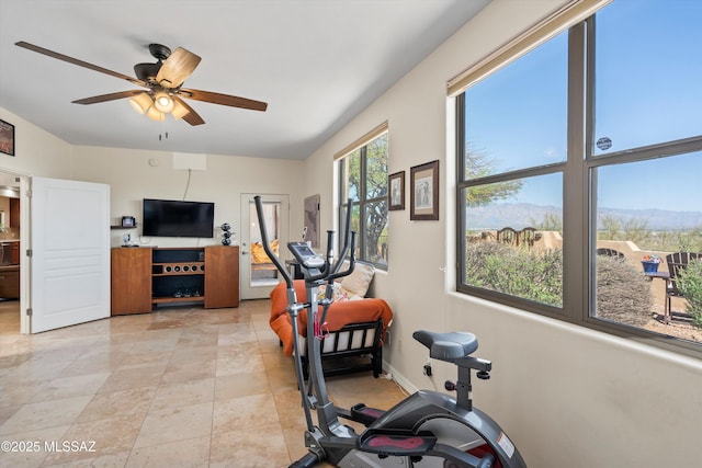 exercise room with ceiling fan