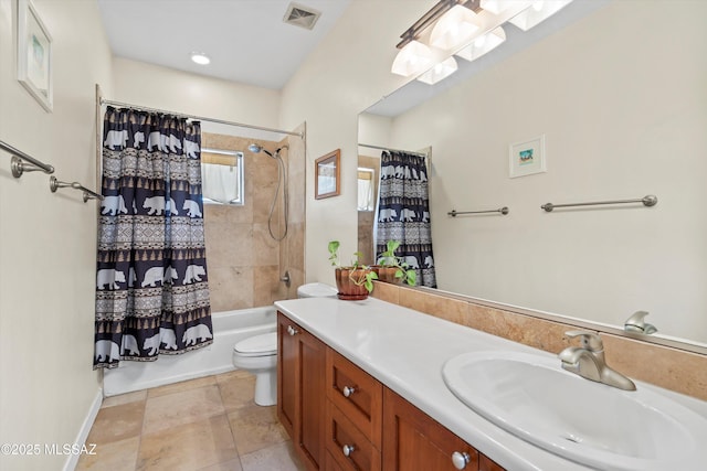 bathroom featuring shower / bath combination with curtain, vanity, visible vents, and toilet