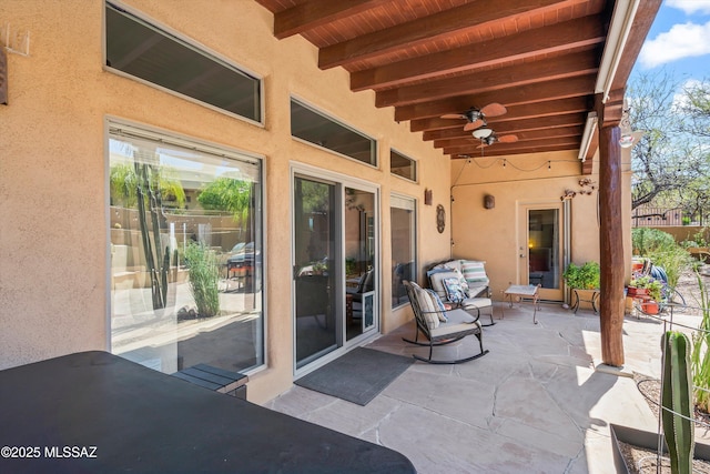 view of patio featuring a ceiling fan