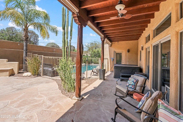 view of patio featuring a fenced backyard, a fenced in pool, and a hot tub