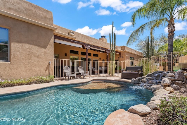 view of pool with a patio, a fenced in pool, and fence