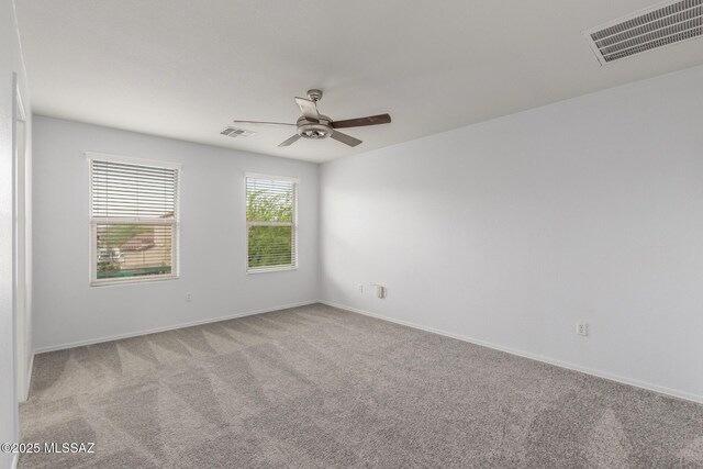 20950 E Frontier Rd, Red Rock, AZ 85145 - unfurnished room with ceiling fan, light carpet, and baseboards