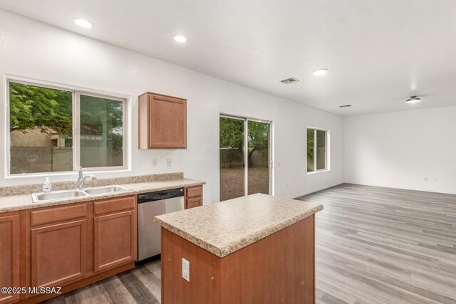 20950 E Frontier Rd, Red Rock, AZ 85145 - kitchen with stainless steel dishwasher, wood finished floors, a kitchen island, light countertops, and recessed lighting