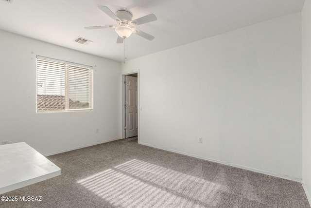20950 E Frontier Rd, Red Rock, AZ 85145 - unfurnished room featuring carpet floors, ceiling fan, and baseboards