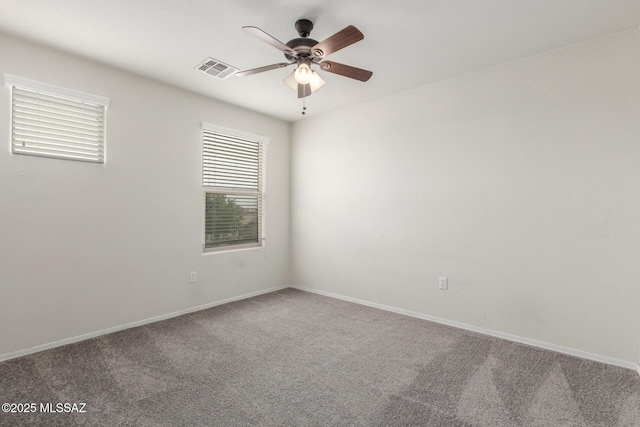 20950 E Frontier Rd, Red Rock, AZ 85145 - spare room with healthy amount of natural light, carpet flooring, ceiling fan, and baseboards