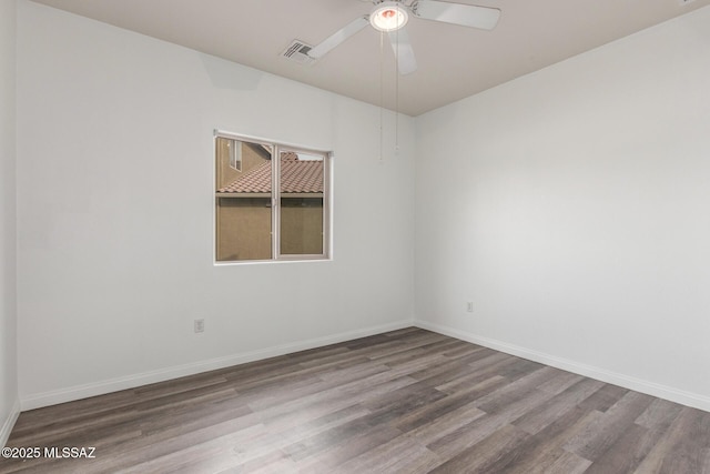 20950 E Frontier Rd, Red Rock, AZ 85145 - empty room featuring wood finished floors, a ceiling fan, and baseboards