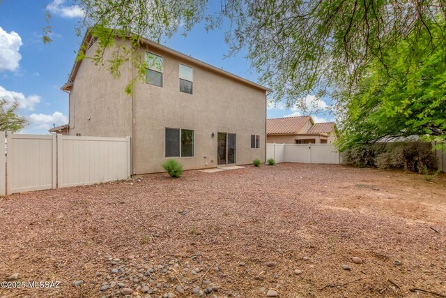 20950 E Frontier Rd, Red Rock, AZ 85145 - rear view of property featuring stucco siding and a fenced backyard