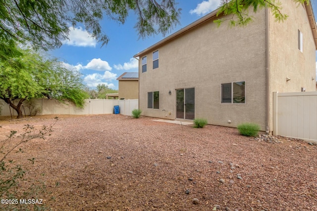20950 E Frontier Rd, Red Rock, AZ 85145 - rear view of house with stucco siding and a fenced backyard