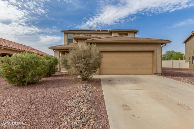 20950 E Frontier Rd, Red Rock, AZ 85145 - view of front facade featuring concrete driveway, a garage, stucco siding, and fence