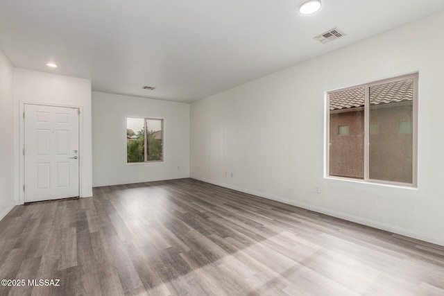 20950 E Frontier Rd, Red Rock, AZ 85145 - unfurnished room featuring wood finished floors, recessed lighting, and baseboards