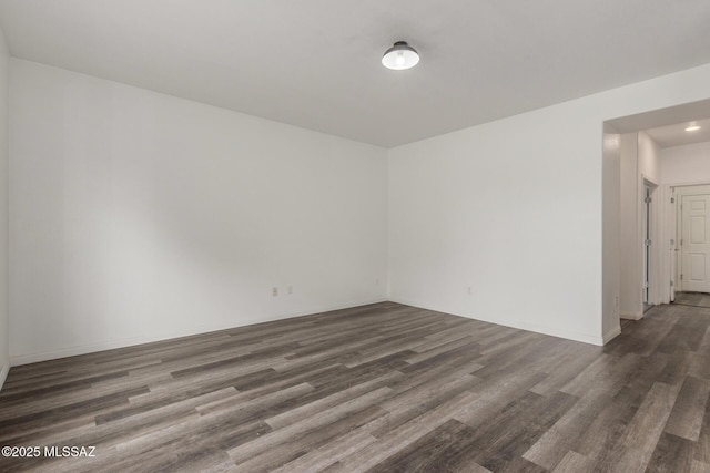 20950 E Frontier Rd, Red Rock, AZ 85145 - spare room featuring dark wood finished floors, baseboards, and recessed lighting