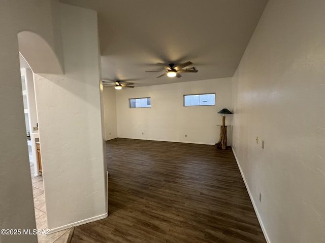 7456 E Placita Del Espiritu, Tucson, AZ 85715 - unfurnished room with wood finished floors, a ceiling fan, and baseboards