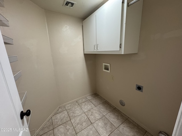 7456 E Placita Del Espiritu, Tucson, AZ 85715 - washroom featuring cabinet space, electric dryer hookup, hookup for a washing machine, light tile patterned floors, and baseboards