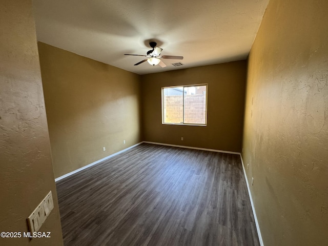 7456 E Placita Del Espiritu, Tucson, AZ 85715 - empty room featuring wood finished floors, a ceiling fan, a textured wall, and baseboards