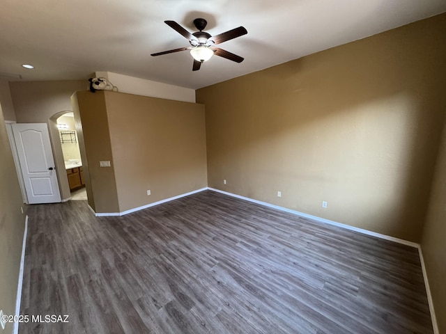 7456 E Placita Del Espiritu, Tucson, AZ 85715 - spare room with a ceiling fan, arched walkways, dark wood-style flooring, and recessed lighting