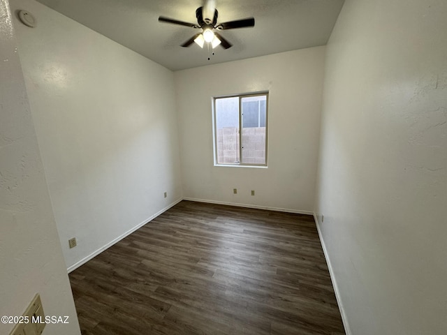 7456 E Placita Del Espiritu, Tucson, AZ 85715 - empty room featuring dark wood-style flooring, ceiling fan, baseboards, and a smoke detector