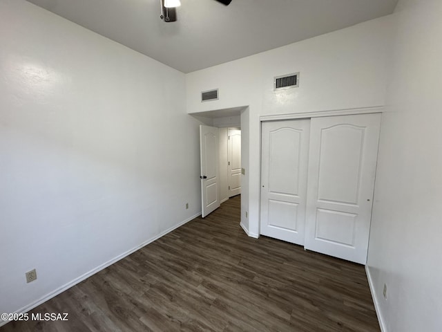 7456 E Placita Del Espiritu, Tucson, AZ 85715 - unfurnished bedroom featuring baseboards, dark wood finished floors, a closet, and ceiling fan