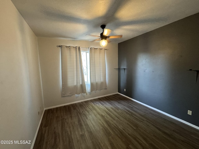 7456 E Placita Del Espiritu, Tucson, AZ 85715 - empty room with a ceiling fan, dark wood-style flooring, baseboards, and a textured ceiling