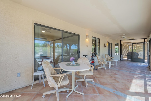 exterior space with ceiling fan