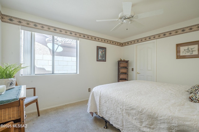 bedroom featuring light carpet, baseboards, and multiple windows