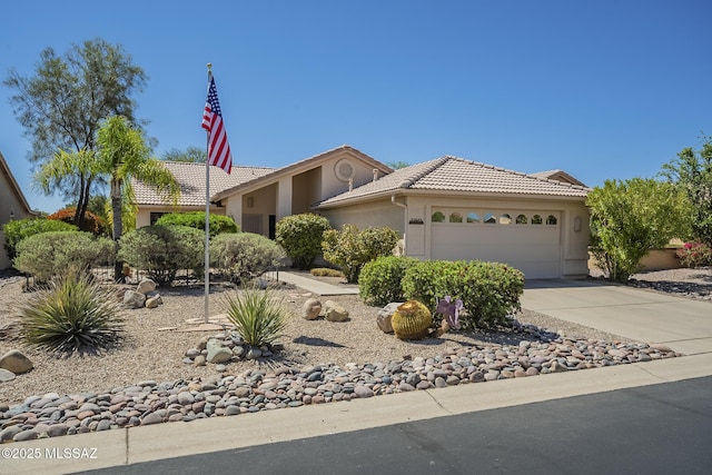 ranch-style house with stucco siding, an attached garage, driveway, and a tiled roof