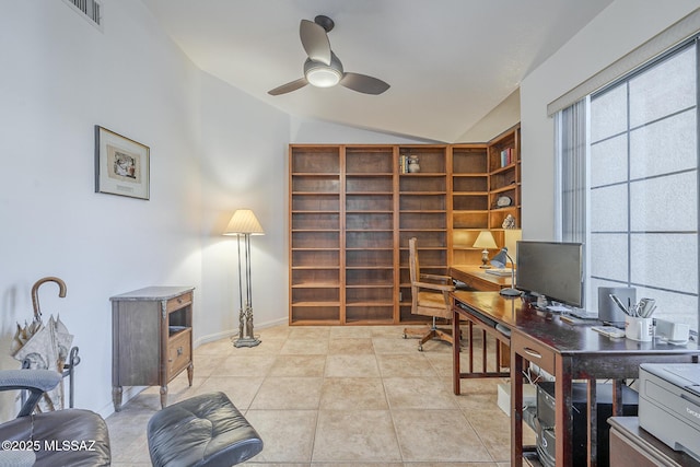 office featuring lofted ceiling, a ceiling fan, visible vents, and light tile patterned flooring