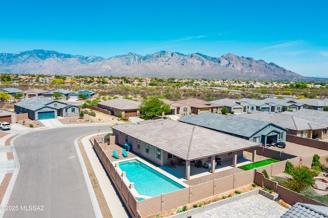 2271 W Azure Creek Loop, Tucson, AZ 85742 - view of swimming pool featuring a residential view, a fenced backyard, a mountain view, and a patio area