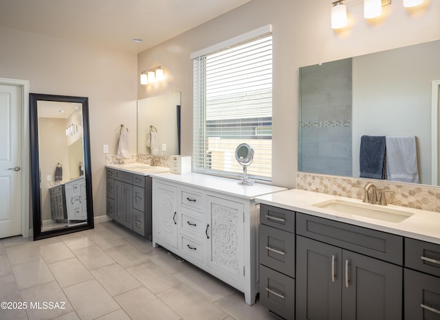full bathroom featuring two vanities and a sink