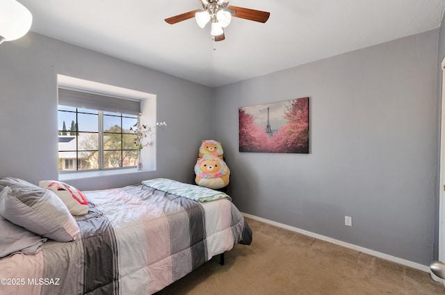 5273 W Fireopal Way, Tucson, AZ 85742 - carpeted bedroom featuring baseboards and a ceiling fan