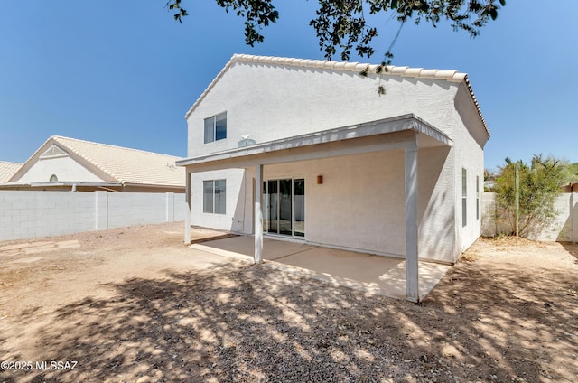 5273 W Fireopal Way, Tucson, AZ 85742 - back of house featuring a patio, a fenced backyard, and stucco siding