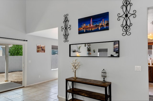 5273 W Fireopal Way, Tucson, AZ 85742 - interior space featuring a towering ceiling, baseboards, and light tile patterned flooring